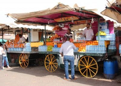 A man riding a horse drawn carriage