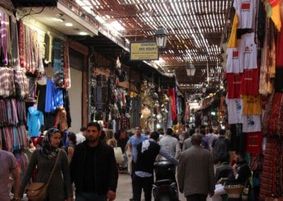 A group of people walking down a street