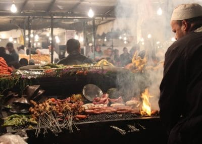 A man cooking food on a grill