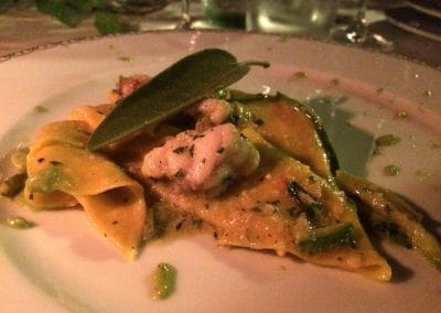 A white plate topped with meat and vegetables