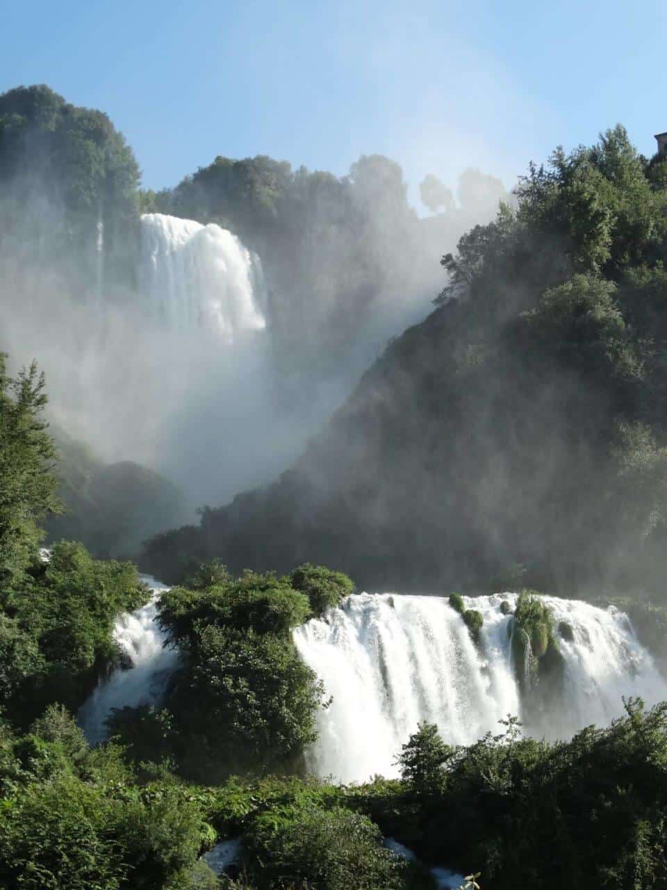 A large waterfall in a forest