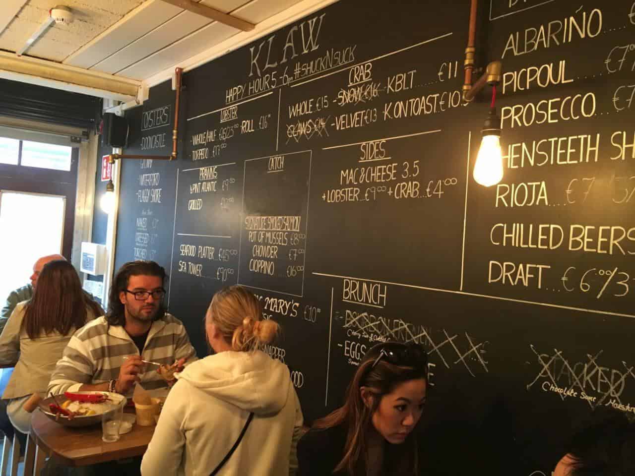 A group of people in front of a blackboard