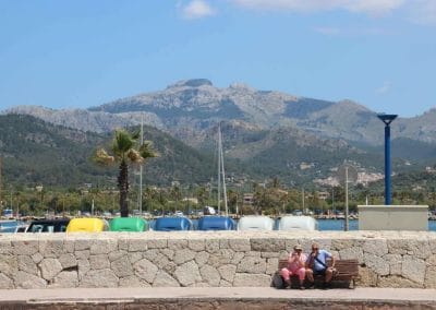 A group of people sitting at a beach