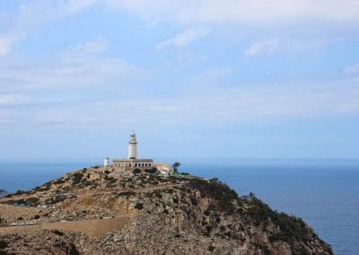 A rocky island in the middle of a body of water