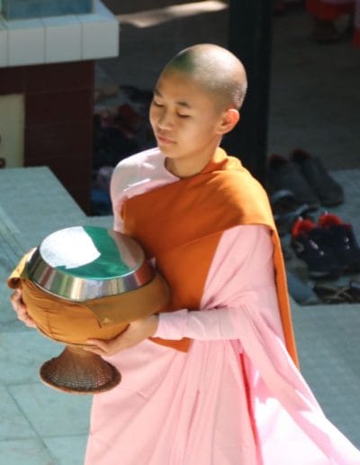 A little boy sitting on a table