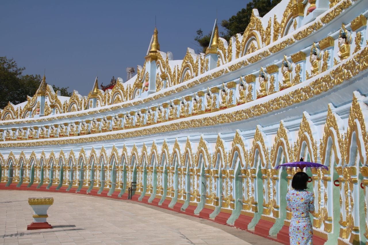 A group of people standing in front of a building