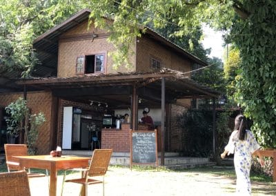 A person standing in front of a house