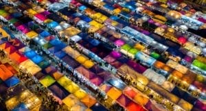 A row of colorful food stalls