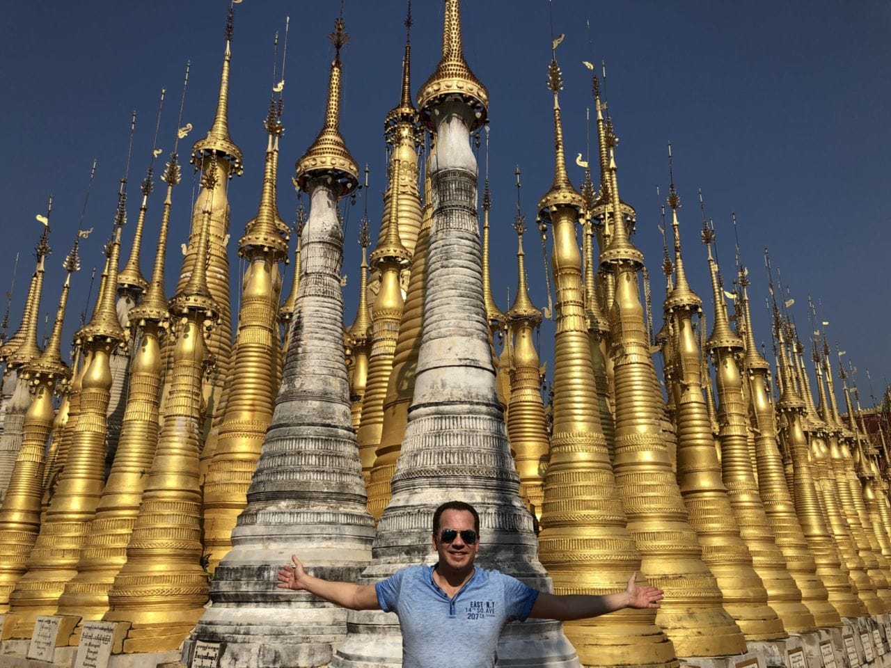 A person standing in front of Stupas